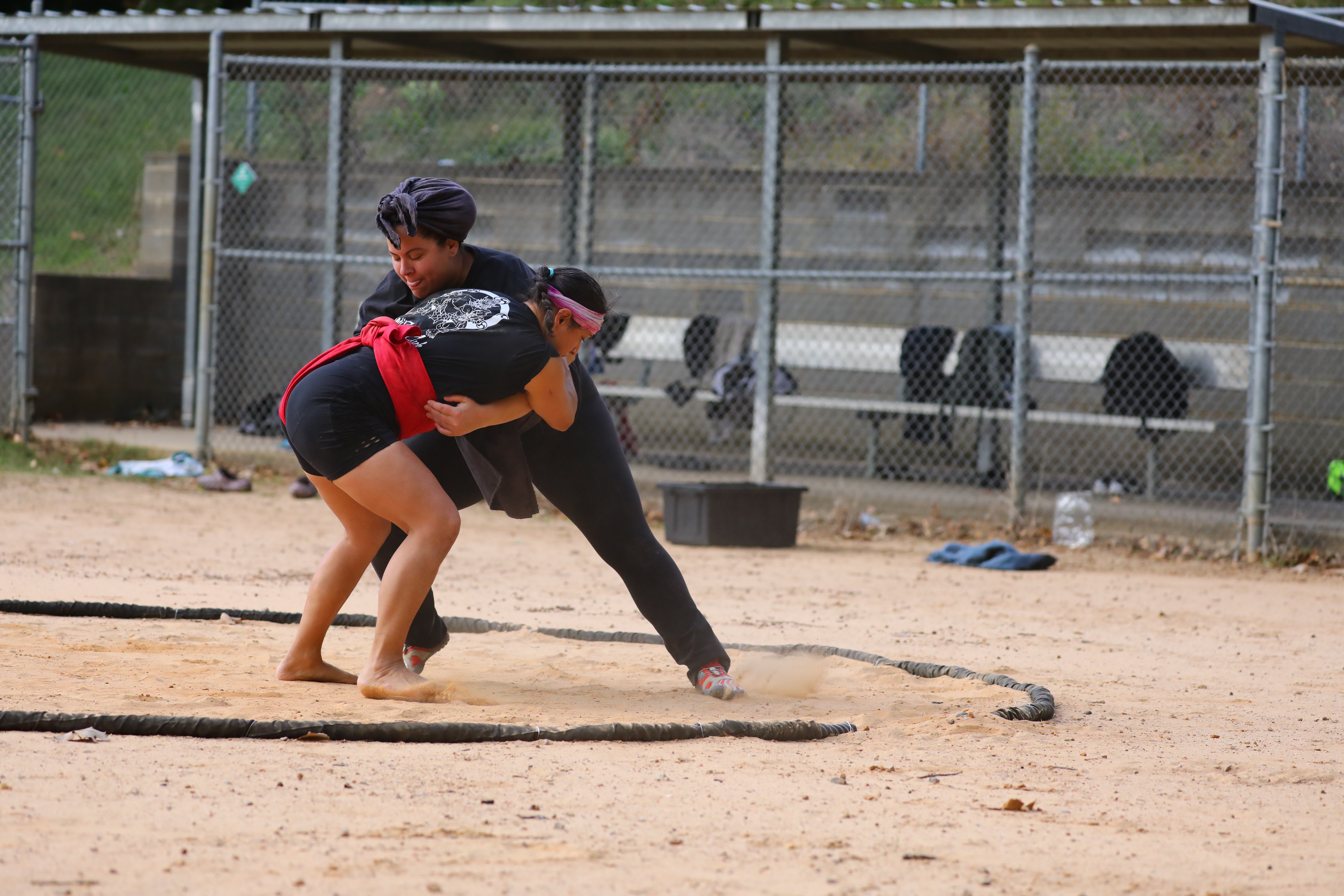 Two wrestlers clinching during a bout
